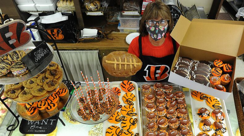 Theresa Hammons the owner of Ashley's Pastry Shop located at 21 Park Ave. displays all the Bengal treats they have for sale. Football bread, cupcakes, cookies and cake pops.  MARSHALL GORBY\STAFF