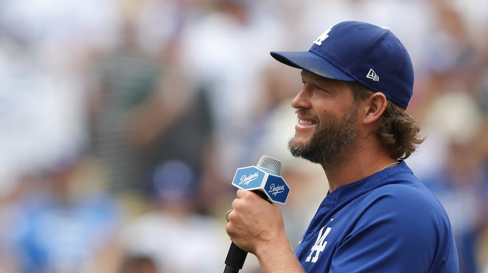 FILE - Los Angeles Dodgers pitcher Clayton Kershaw speaks to fans before a baseball game against the San Francisco Giants, Sept. 21, 2025, in Los Angeles. (AP Photo/Jessie Alcheh, File)