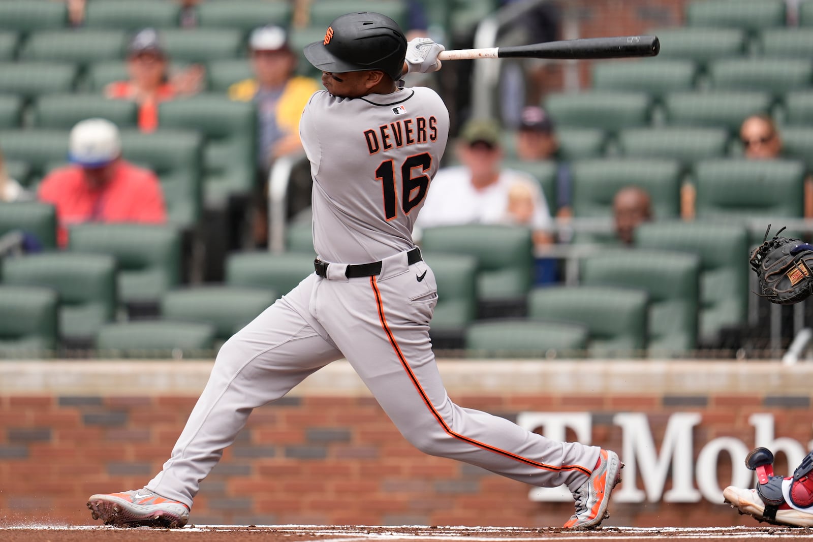 San Francisco Giants designated hitter Rafael Devers (16) hits a single in the first inning of a baseball game against the Atlanta Braves, Wednesday, July 23, 2025, in Atlanta. (AP Photo/Mike Stewart)