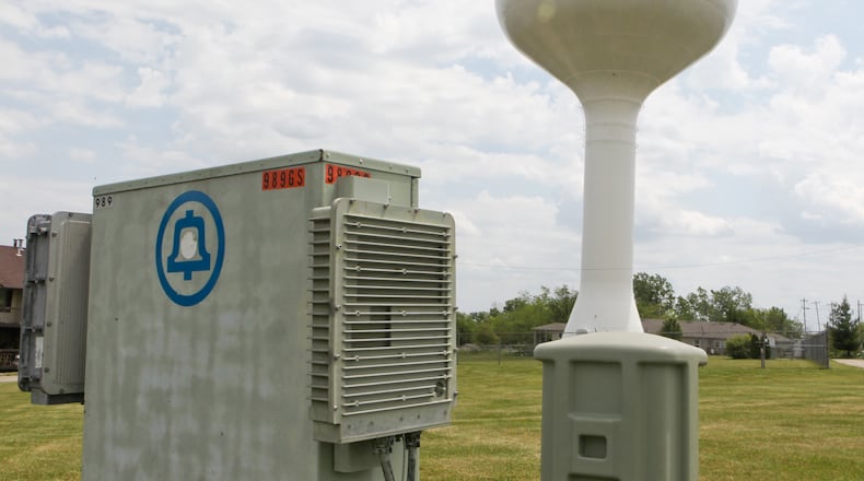 A Cincinnati Bell cell tower atop the water tower on Eaton Road. Staff photo by Greg Lynch