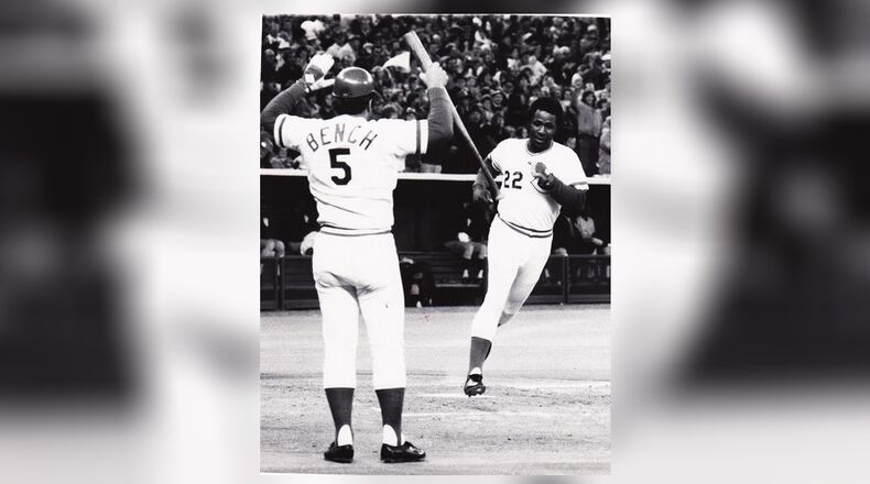 Johnny Bench is there to greet Dan Driessen after he scores a run during the 1976 World Series. DDN FILE