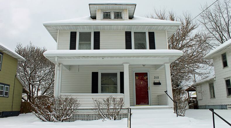 Built in 1924, this 2-story home has been updated and features a covered front porch and formal living and dining rooms. CONTRIBUTED PHOTOS BY VICKIE KAPNAS