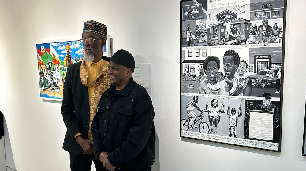 Springfield artist Nathan Conner, right, has depicted the experience of Haitian immigrants in Springfield with a new series of paintings. He is participating in an exhibition curated by legendary artist Willis "Bing" Davis, pictured alongside Conner. BRETT TURNER / CONTRIBUTED