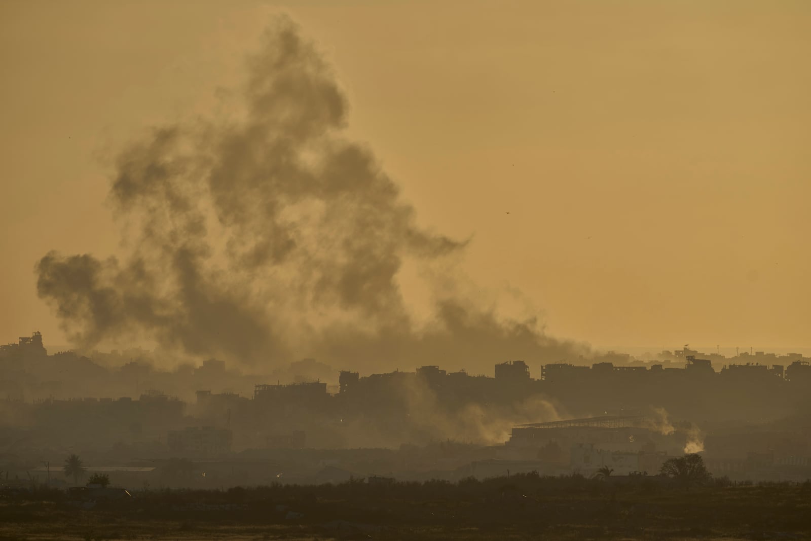 Smoke rises following an Israeli army bombardment in the Gaza Strip, seen from southern Israel, Wednesday, May 21, 2025. (AP Photo/Ohad Zwigenberg)