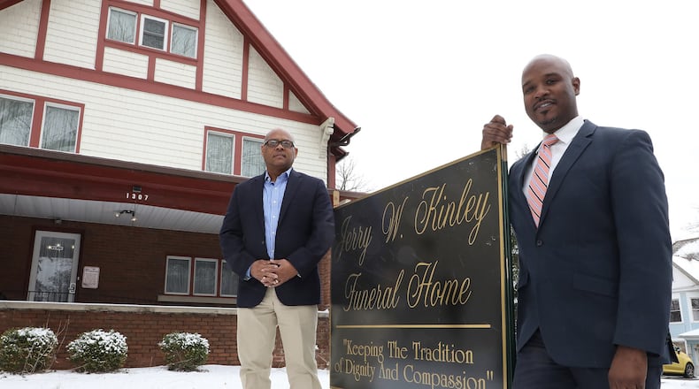 Jerry Kinley, right, and Ben Cox in front of the new Jerry W. Kinley Funderal Home on East High Street in Springfield Wednesday, March 21, 2018. Bill Lackey/Staff
