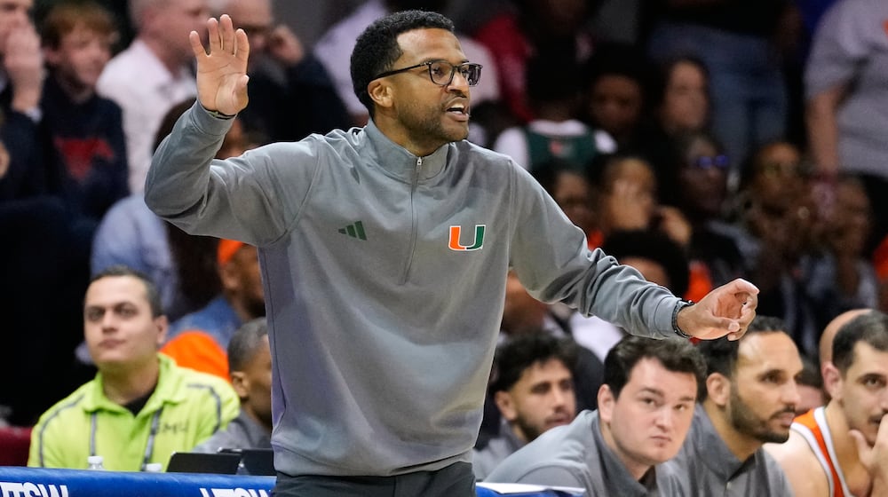 Miami head coach Jai Lucas reacts to play in the second half of an NCAA college basketball game against SMU in Dallas, Wednesday, March 4, 2026. (AP Photo/Tony Gutierrez)