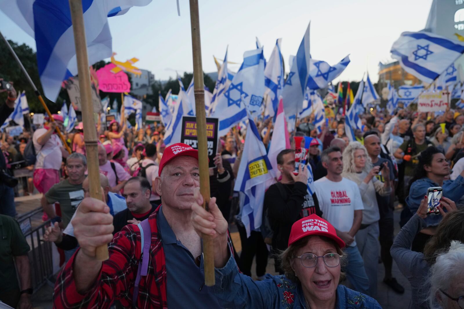 People take part in a protest demanding the end of the war and immediate release of hostages held by Hamas in the Gaza Strip, and against Prime Minister Benjamin Netanyahu's government in Tel Aviv, Israel, Saturday, May 3, 2025.(AP Photo/Ariel Schalit)