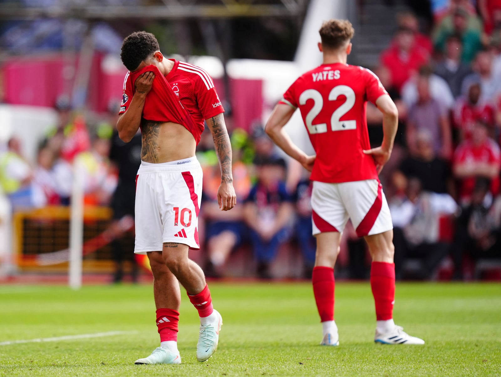 Nottingham Forest's Morgan Gibbs-White, left, and Ryan Yates appear dejected during a Premier League soccer match against Leicester City at the City Ground in Nottingham, England, Sunday May 11, 2025. (Mike Egerton/PA via AP)