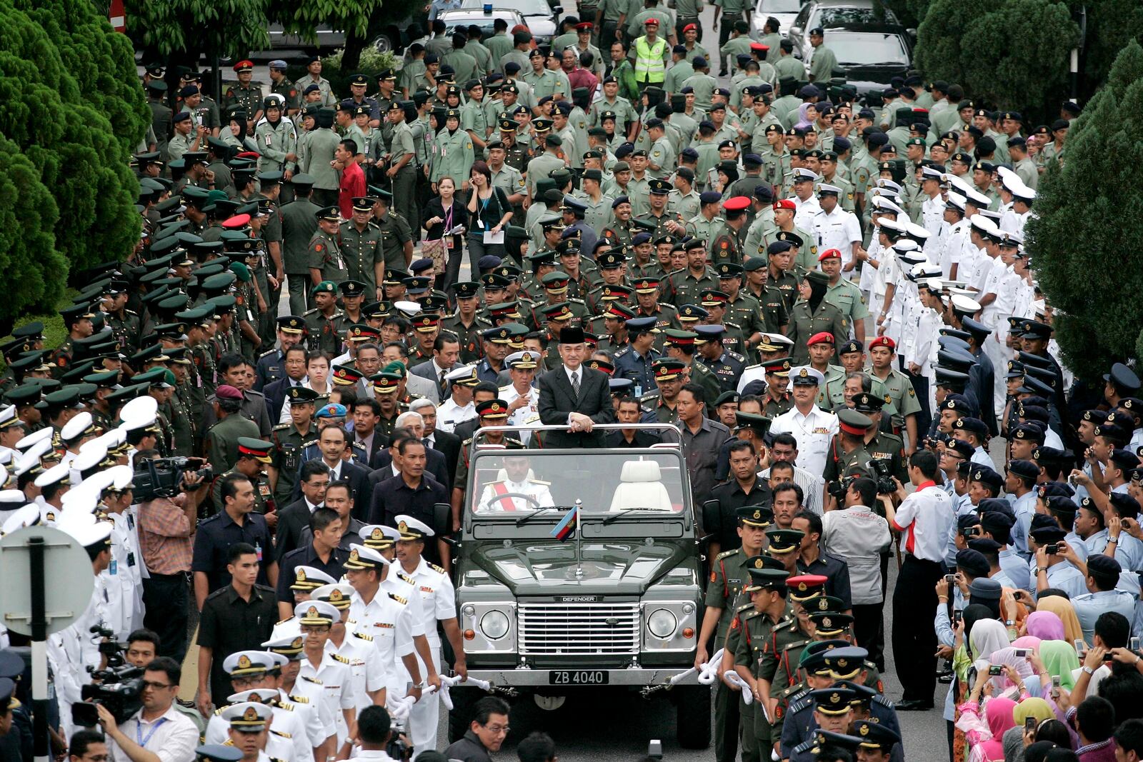 FILE - Malaysian outgoing Prime Minister Abdullah Ahmad Badawi, also Defence Minister, center, looks on during a farewell ceremony organised by the Defence Ministry in Kuala Lumpur, Malaysia, Thursday, April 2, 2009. (AP Photo/Lai Seng Sin, File)