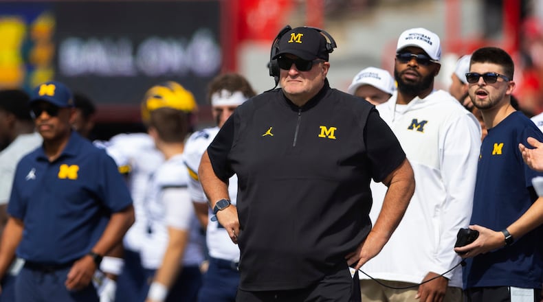 FILE - Michigan acting head coach Biff Poggi watches as his team plays against Nebraska during the first half of an NCAA college football game Saturday, Sept. 20, 2025, in Lincoln, Neb. (AP Photo/Rebecca S. Gratz, File)