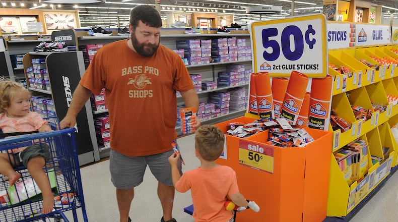 Mark Gunton with his childern Monica and Drew was shopping for school supplies at the Meijer Store on Wilmington Pike on Friday, July 30, 2021. MARSHALL GORBY\STAFF