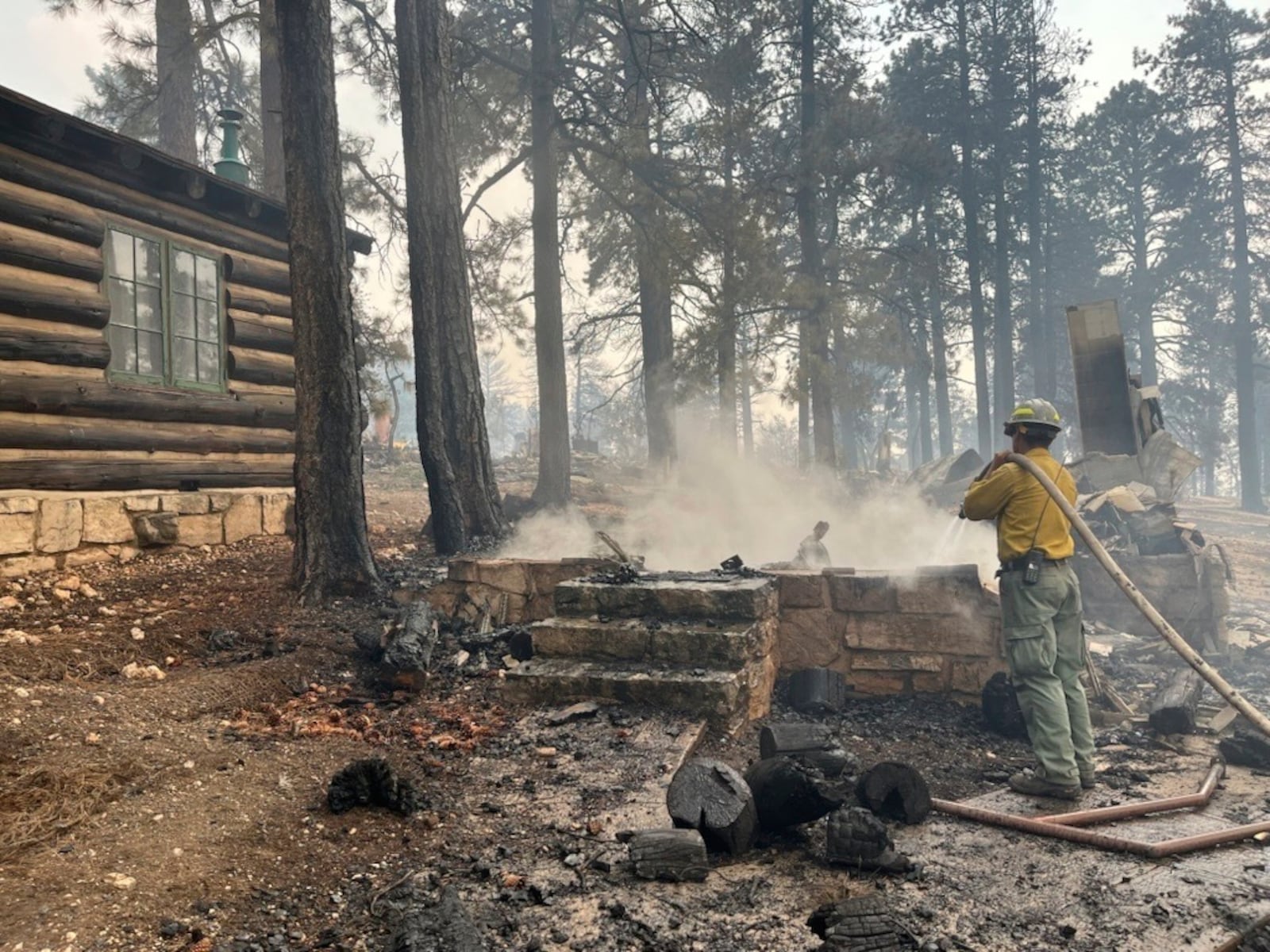This photo provided by National Park Service shows the charred remains of a building at the North Rim of Grand Canyon National Park, in northern Arizona, on Sunday, July 13, 2025. (National Park Service via AP)