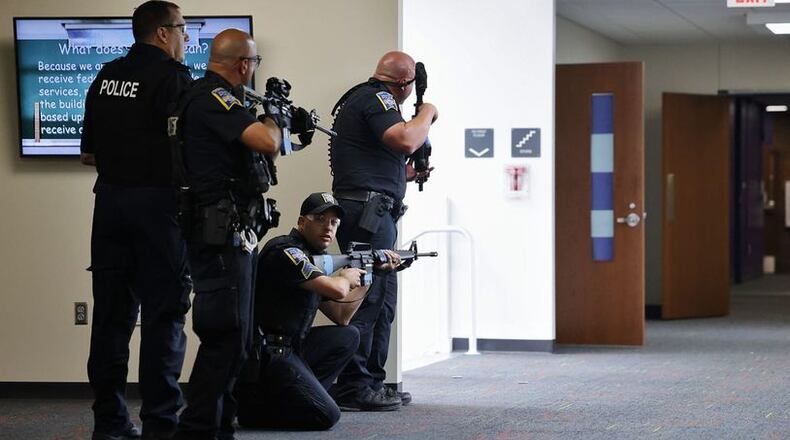 Recent violent threats against area schools and beyond were revealed to be hoaxes but still caused chaos for thousands. The active shooter threats were fake but the costs in lost classroom learning weren’t, say area school officials. Pictured is a recent "active shooter" drill at Middletown High School. (Photo By Nick Graham\Journal-News)