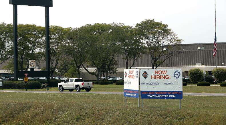 A "Now Hiring" sign was placed in front of Navistar in September. The unemployment rate in Clark County during that month was 7.5%. BILL LACKEY/STAFF