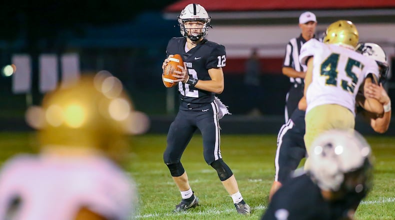 Greenon High School junior Kaden Wooten stands in the pocket during their game against Catholic Central on Friday night at Greenon Stadium in Springfield. Wooten scored on a 37-yard run late in the fourth quarter to lift the Knights to a 10-6 victory. CONTRIBUTED PHOTO BY MICHAEL COOPER