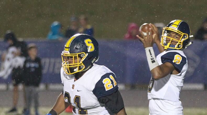 Springfield QB Te’Sean Smoot is protected by running back Tavion Smoot. Springfield defeated host Springboro 23-0 in a Week 7 high school football game on Friday, Oct. 11, 2019. MARC PENDLETON / STAFF