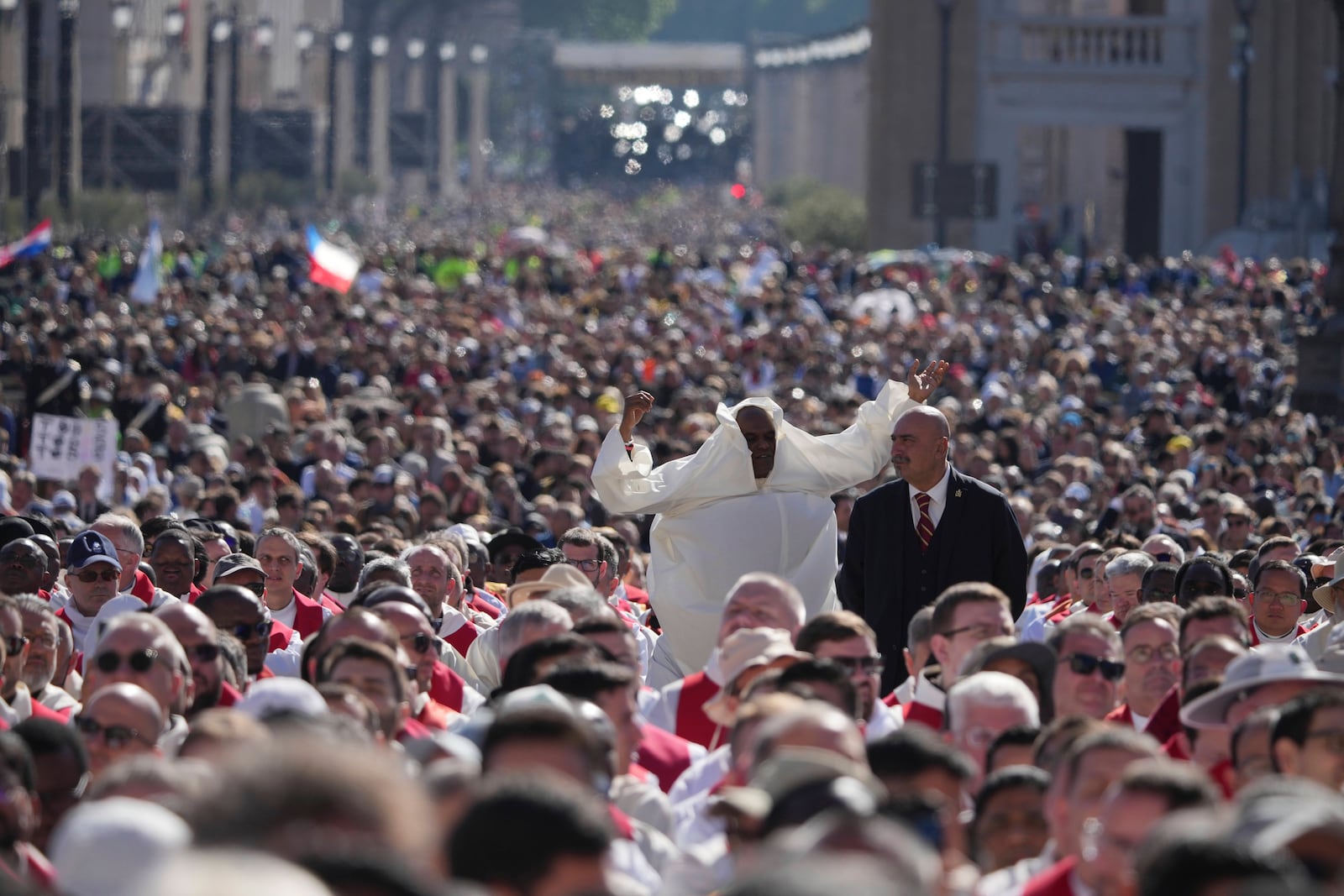 Faithful gather during the funeral of Pope Francis in St. Peter's Square at the Vatican, Saturday, April 26, 2025. (AP Photo/Alessandra Tarantino)