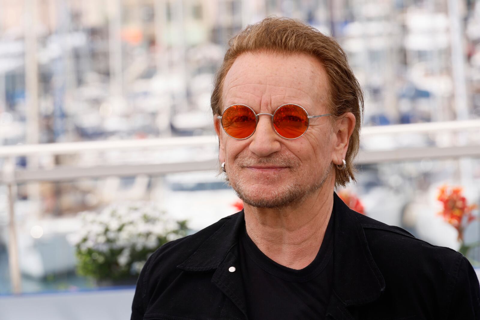 Bono poses for photographers at the photo call for the film 'Bono: Stories of Surrender' at the 78th international film festival, Cannes, southern France, Saturday, May 17, 2025. (Photo by Joel C Ryan/Invision/AP)