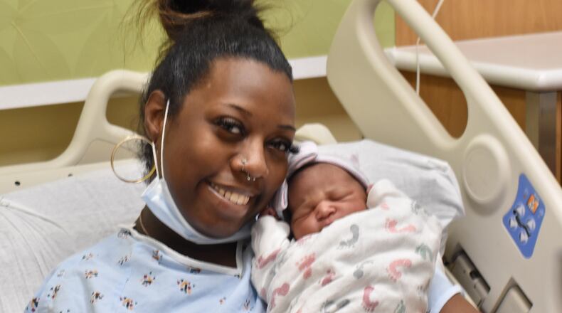 Jasmine Robinson, of Dayton, with newborn baby Rankin, who was born at 3:59 a.m. on New Year's Day in 2023 at Miami Valley Hospital in Dayton. SAMANTHA WILDOW\STAFF