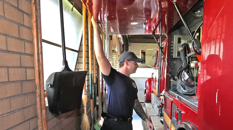 Springfield firefighters have to be careful when opening the doors on the fire engine because the garage bay is so small at Fire Station 3 on Selma. That station is looking to be replaced as the City of Springfield plans to build three new stations. BILL LACKEY/STAFF