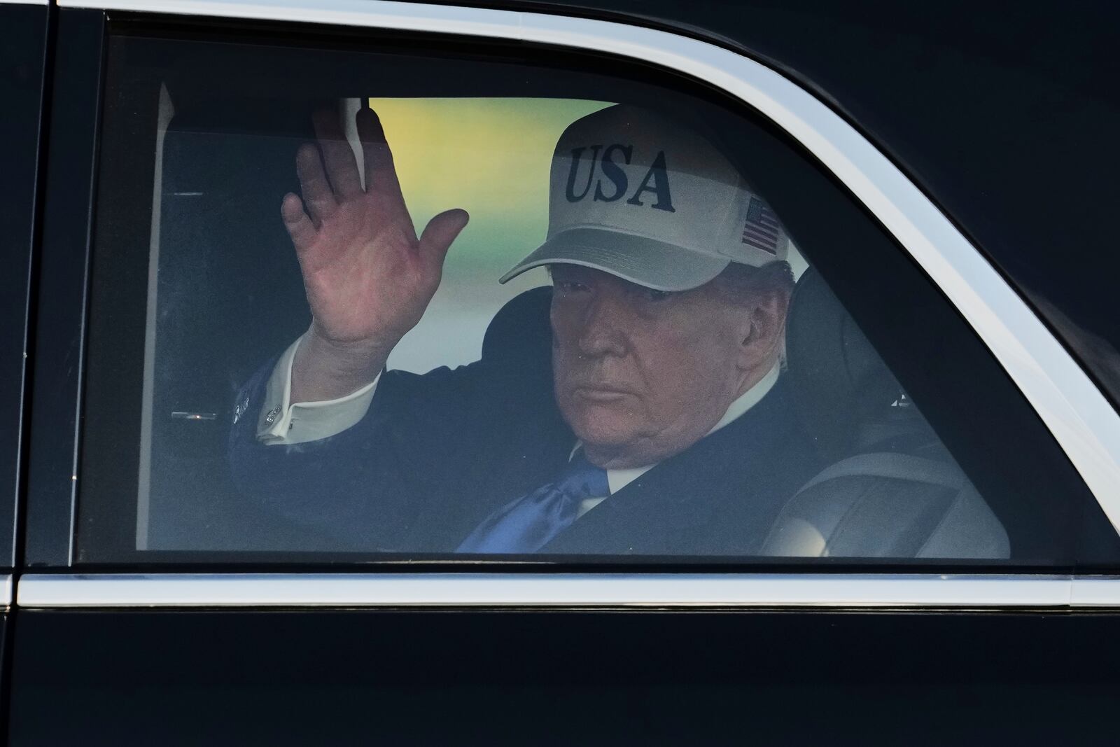 President Donald Trump waves after arriving at Amsterdam Schiphol Airport ahead of the NATO summit, taking place in The Hague, Netherlands, Tuesday, June 24, 2025. (AP Photo/Peter Dejong)