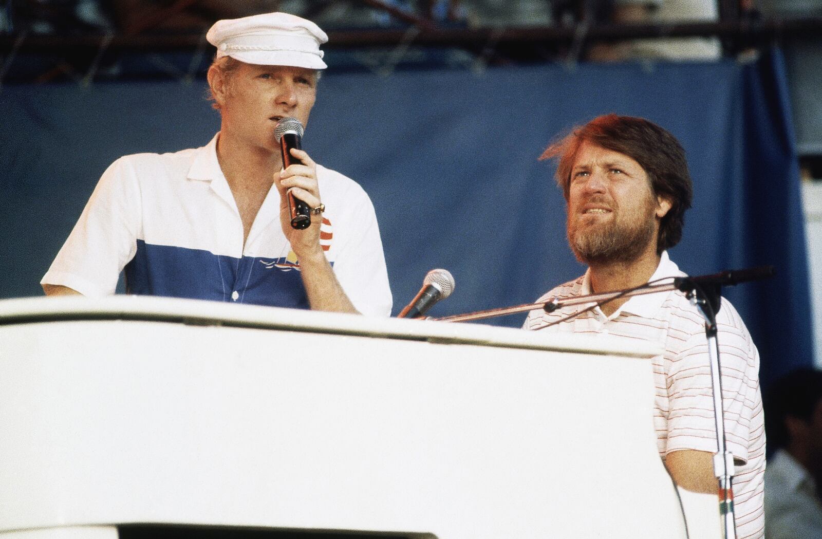 FILE - Mike Love, left, and Brian Wilson of The Beach Boys, perform at the Miller Time concert on Pier 84 on July 8, 1983 in New York. (AP Photo/ David Handschuh, File)
