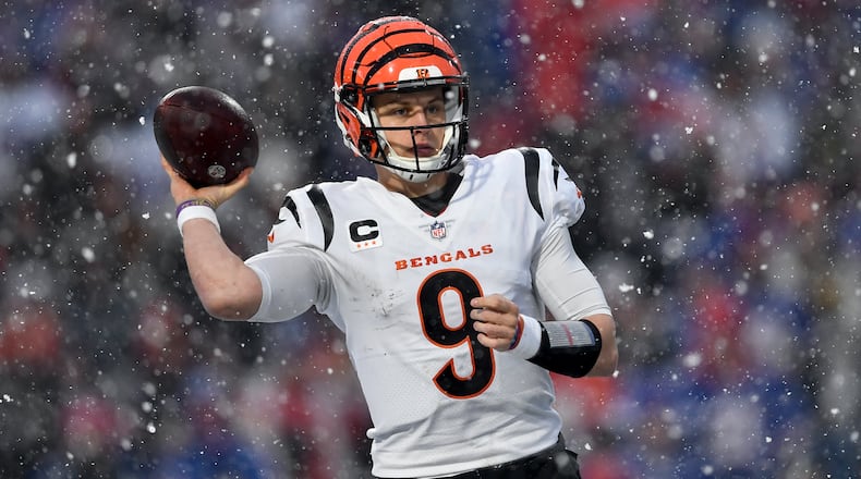 Cincinnati Bengals quarterback Joe Burrow (9) passes against the Buffalo Bills during the third quarter of an NFL division round football game, Sunday, Jan. 22, 2023, in Orchard Park, N.Y. (AP Photo/Adrian Kraus)