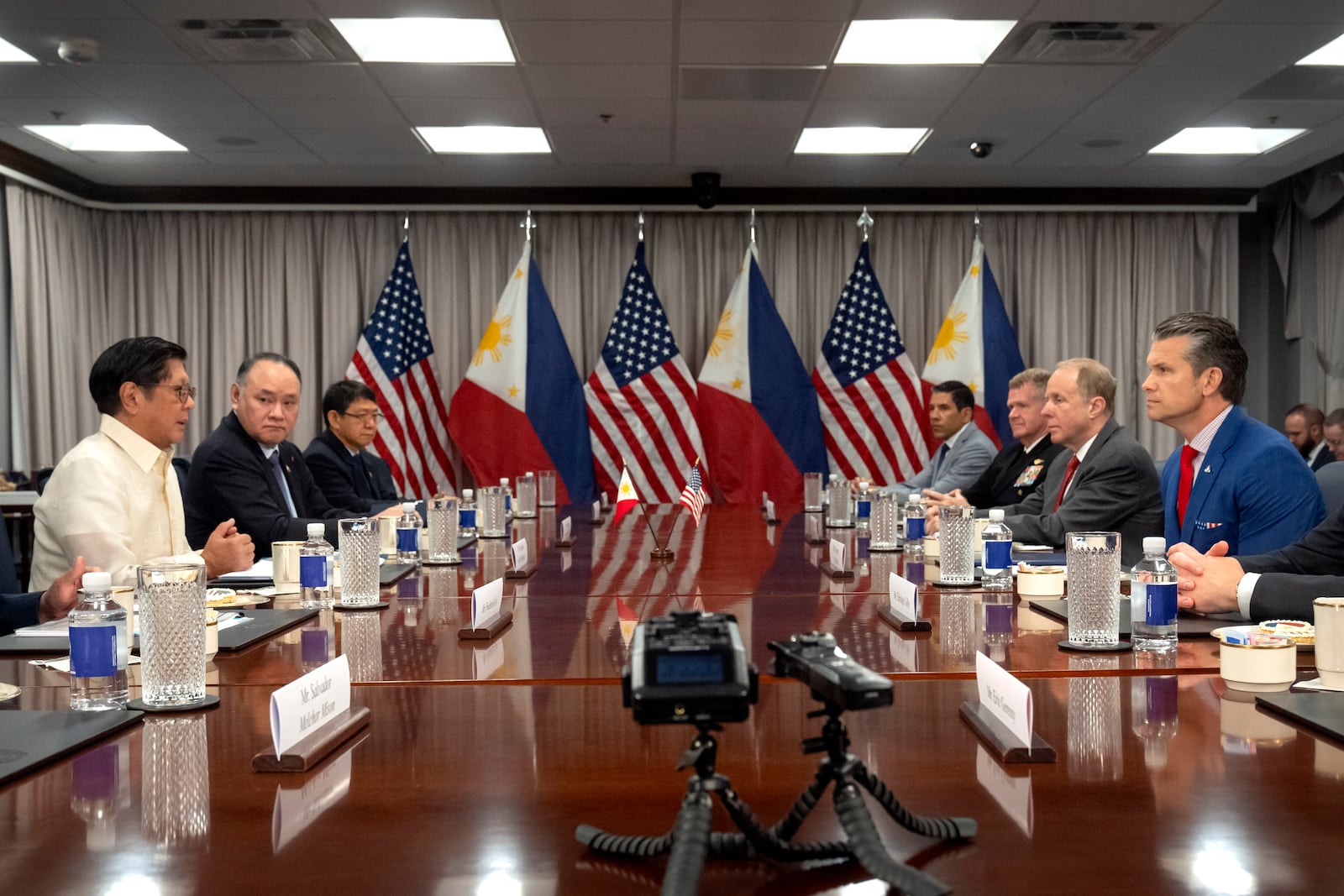 Philippine President Ferdinand Marcos Jr., left, speaks during a meeting with Secretary of Defense Pete Hegseth, right, at the Pentagon, Monday, July 21, 2025, in Washington. (AP Photo/Mark Schiefelbein)