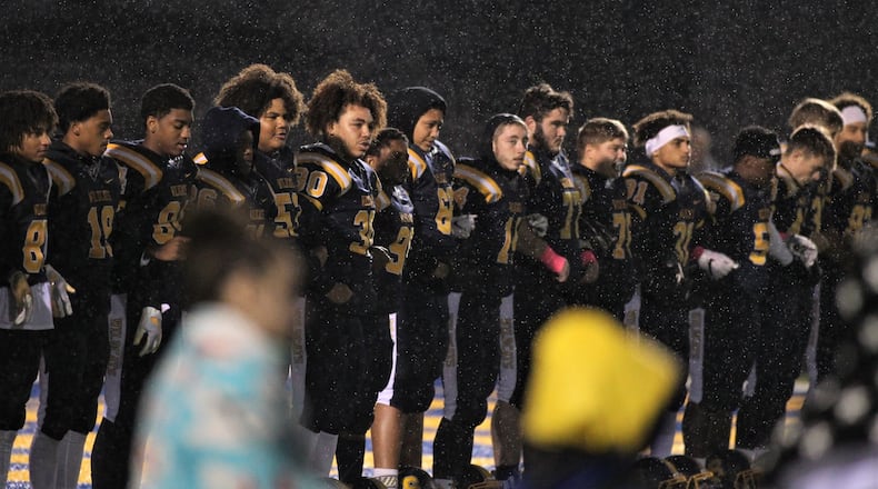 Springfield stands for the national anthem before a game against Fairmont on Friday, Oct. 26, 2018, at Evans Stadium in Springfield. David Jablonski/Staff