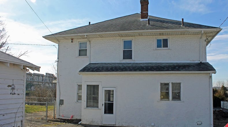 There is a fenced side yard and an enclosed porch on the main house.