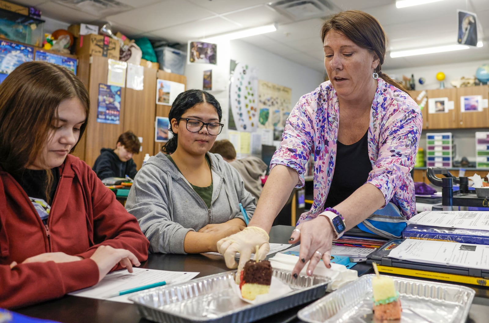 Eighth grade science teacher Tonya Collinsworth gives her students advice as they participate in a sedimentary rock activity at Shawnee Middle School on Thursday, March 12, 2026, in Springfield. She's one of four teachers who will receive an Excellence in Teaching Award on March 23. JOSEPH COOKE/STAFF