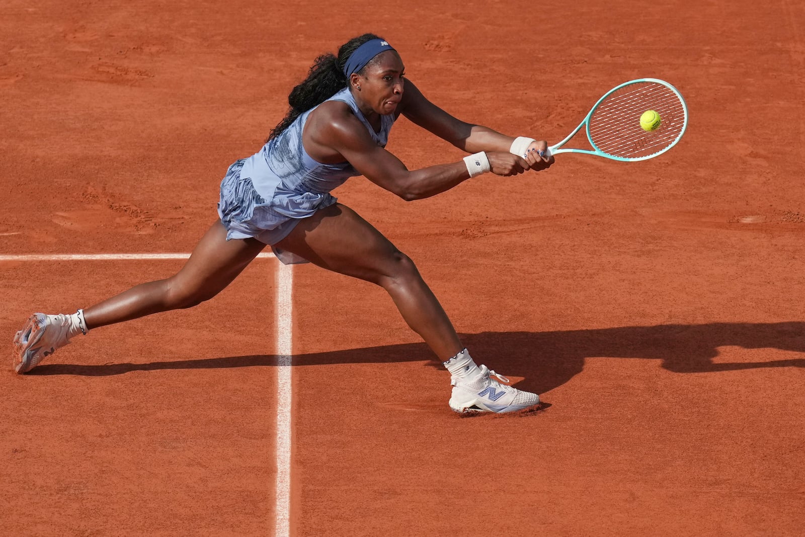 Coco Gauff of the U.S. returns the ball to Marie Bouzkova of the Czech Republic during their third round match of the French Tennis Open, at the Roland-Garros stadium, in Paris, Saturday, May 31, 2025. (AP Photo/Christophe Ena)