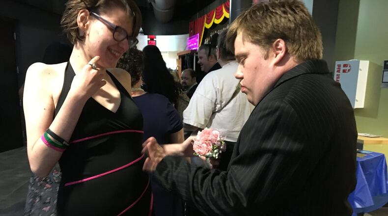 Zan Mullett offers a corsage to his date Taylor Brown at the Developmental Disabilities of Clark County s Spring Prom at the Hollenbeck Bayley Creative Arts and Conference Center on Wednesday. BRETT TURNER/CONTRIBUTING