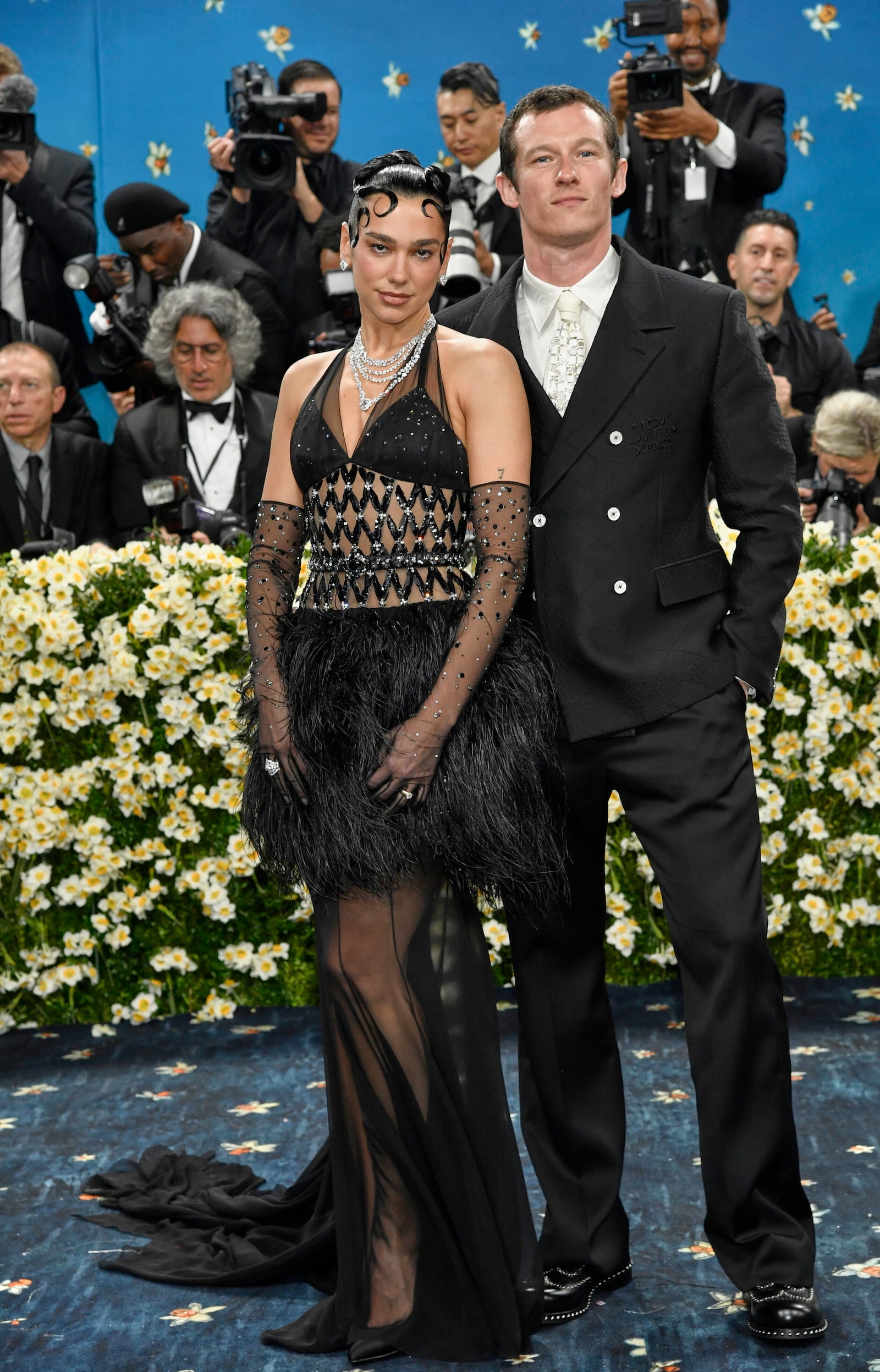 Dua Lipa, left, and Callum Turner attend The Metropolitan Museum of Art's Costume Institute benefit gala celebrating the opening of the "Superfine: Tailoring Black Style" exhibition on Monday, May 5, 2025, in New York. (Photo by Evan Agostini/Invision/AP)
