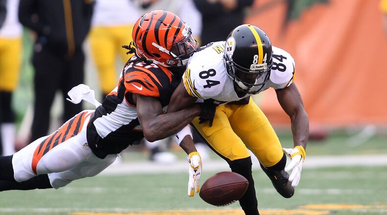 Bengals cornerback Dre Kirkpatrick breaks up a pass intended for Antonio Brown of the Steelers in a 2015 game in Paul Brown Stadium. They sure looked friendly over the weekend.
