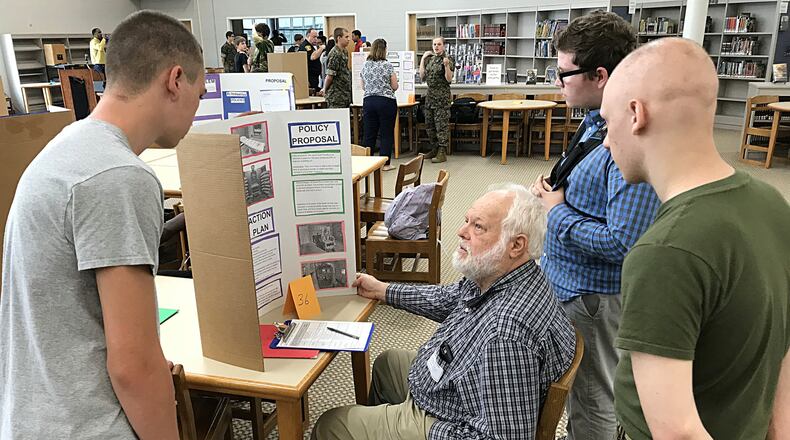 Springfield Mayor Warren Copeland asks Springfield High School students questions about their Death Penalty project at a recent Policy Fair. JEFF GUERINI/STAFF