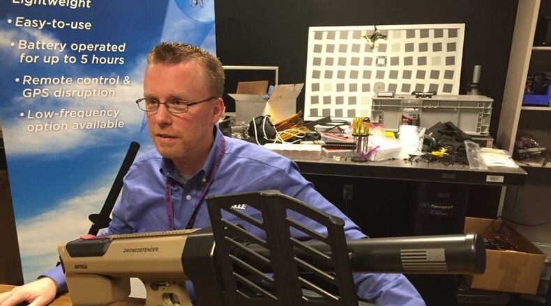Battelle’s Dan Stamm with the drone defender he helped invent. BYRON STIRSMAN/PHOTO