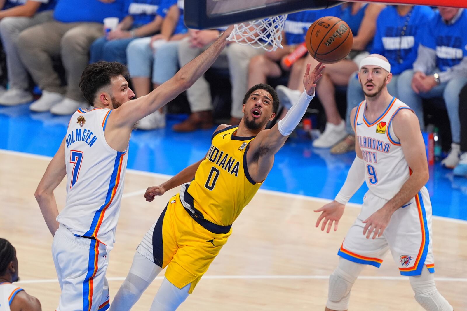 Indiana Pacers guard Tyrese Haliburton (0) shoots as Oklahoma City Thunder forward Chet Holmgren (7) defends during the second half of Game 5 of the NBA Finals basketball series, Monday, June 16, 2025, in Oklahoma City. (AP Photo/Kyle Phillips)