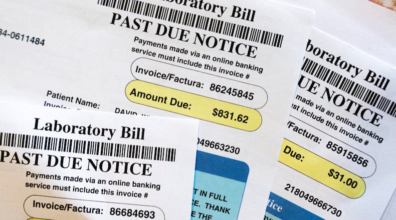 FILE - Medical bills are seen in Temple Hills, Md., on June 26, 2023. The Collaboratory, Mercy Health, the Turner Foundation, the nonprofit Undue Medical Debt and others are working on a campaign to eliminate $9.1 million in medical debt in Clark County by raising $51,000 to purchase that debt and forgive it. (AP Photo/Jacquelyn Martin, File)