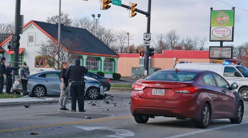 Police investigate the scene at the intersection of Belmont Avenue and East Main Street, where a pursuit ended in a multi-vehicle crash Tuesday, Nov. 26, 2024. BILL LACKEY/STAFF
