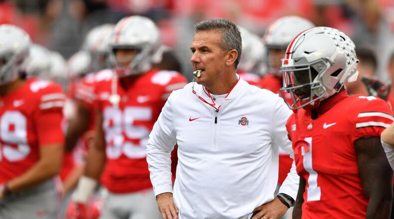 COLUMBUS, OH - SEPTEMBER 22: Head Coach Urban Meyer of the Ohio State Buckeyes watches as his team warms up before a game against the Tulane Green Wave at Ohio Stadium on September 22, 2018 in Columbus, Ohio. (Photo by Jamie Sabau/Getty Images)