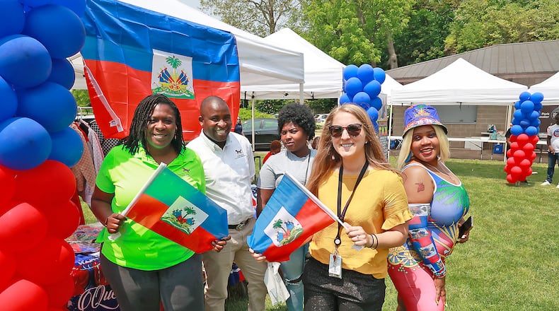 A group from the Rocking Horse Center with Guerline Etienne, right, at the Haitian Flag Day Festival Thursday, May 18, 2023. BILL LACKEY/STAFF