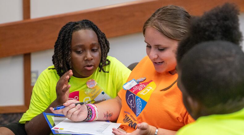 A counselor talks with participants in a Springfield Promise Neighborhood summer camp in this 2023 photo. CONTRIBUTED
