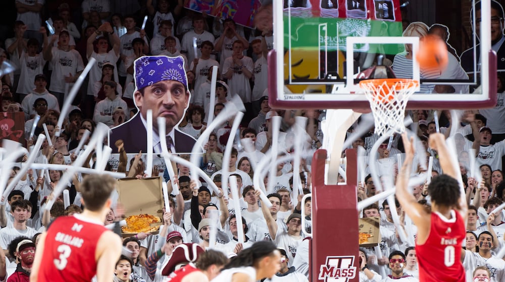 The Massachusetts student section cheers as Miami Ohio wing Eian Elmer (0) attempts a free throw during the NCAA basketball game at The Mullins Center in Amherst, Mass., Tuesday, Feb. 17, 2026. (Daniel Jacobi II/The Daily Hampshire Gazette via AP)
