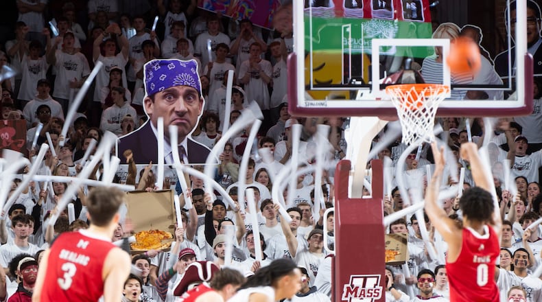 The Massachusetts student section cheers as Miami Ohio wing Eian Elmer (0) attempts a free throw during the NCAA basketball game at The Mullins Center in Amherst, Mass., Tuesday, Feb. 17, 2026. (Daniel Jacobi II/The Daily Hampshire Gazette via AP)
