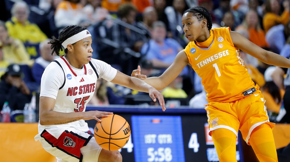 North Carolina State guard Zoe Brooks, left, drives against Tennessee guard Nya Robertson, right, during the first half in the first round of the NCAA college basketball tournament Friday, March 20, 2026, in Ann Arbor, Mich. (AP Photo/Al Goldis)