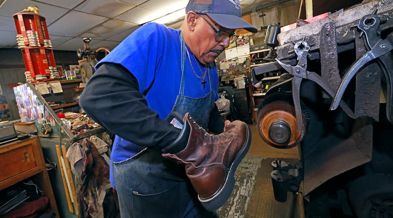 Clifford Borden, owner of Pritchet Shoe Service, has been repairing shoes for over 30 years and took over the business when "Mr. Pritchet" retired. BILL LACKEY/STAFF
