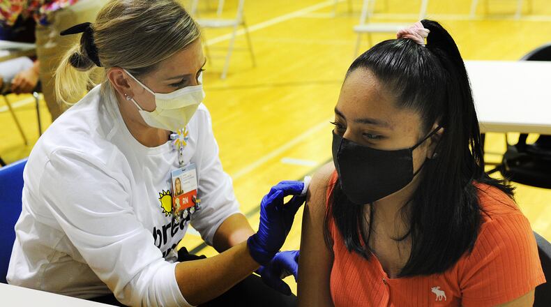 Brittany Arquelles, age 12, prepares for her COVID-19 vaccine Friday June 4, 2021. Dayton Children’s partners with Boys & Girls Club of Dayton to offer COVID-19 vaccine clinic for individuals 12 years and older. MARSHALL GORBY\STAFF