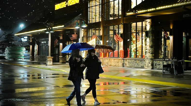 Black Friday shoppers deal with rainy chilly weather to get good deals at Cabela’s in Centerville Friday morning on Nov. 25, 2022. MARSHALL GORBY \STAFF