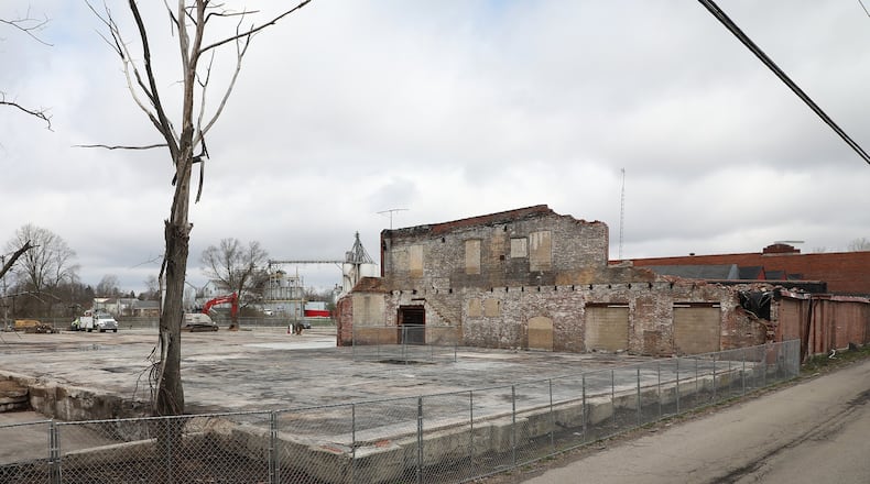 The Q3 redevelopment project in Urbana is progressing with the demolition of part of the structure that was destroyed by a fire and the clean up of the remaining structures. BILL LACKEY/STAFF